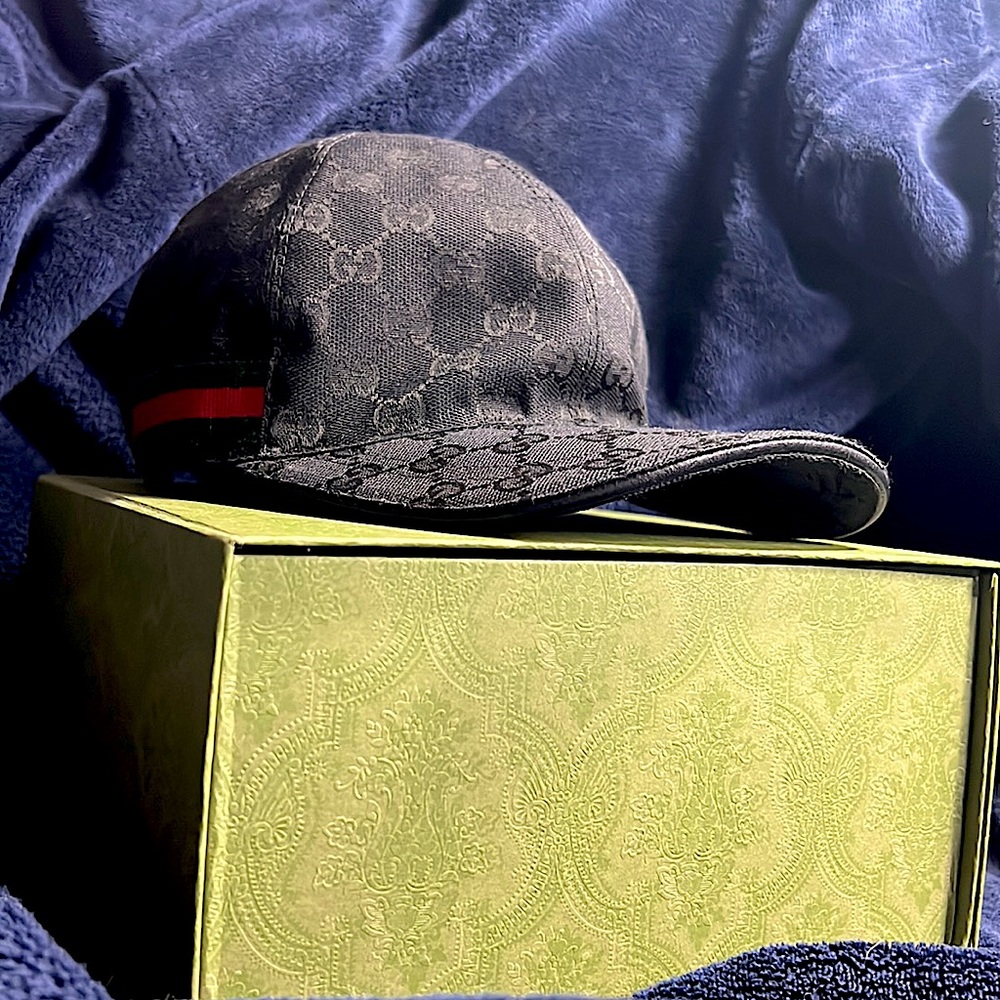 Authentic  Gucci black monogram hat with stripe.